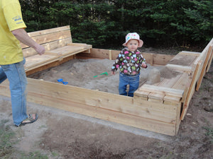 Wooden sandbox with foldable seats