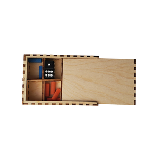 Wooden box with compartments containing pegs and dice on a white background
