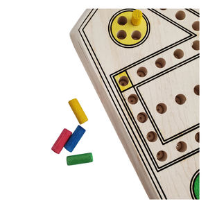 Wooden game board with colorful cylindrical pieces on a white background