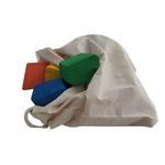 Colorful wooden blocks in a drawstring bag on a white background 7