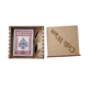 Maverick playing cards in a wooden box with a leather case on a white background