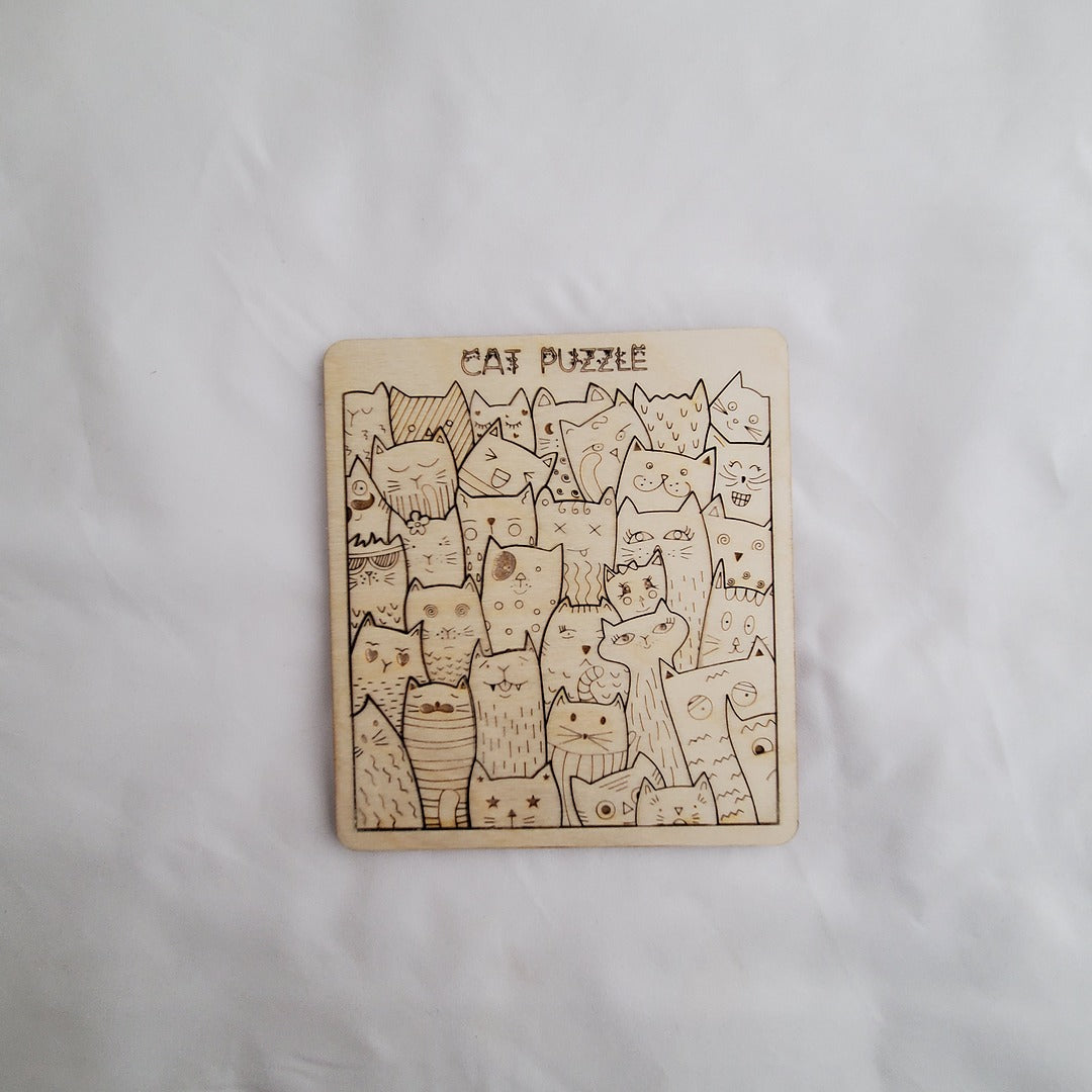 Wooden puzzle with cat illustrations on a white background