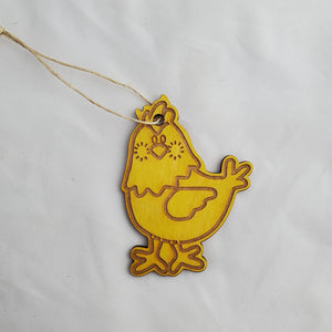 Yellow chicken-shaped ornament on a white background
