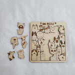 Wooden dog puzzle with pieces on a white background 9