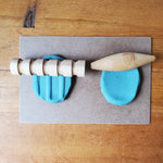 Wooden rolling pin and blue play dough 8