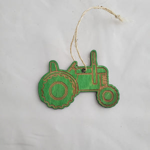 Green and brown decorative key-shaped ornament on a white background