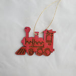 Red train ornament with accents on a white background 4