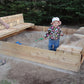 Wooden sandbox with foldable seats